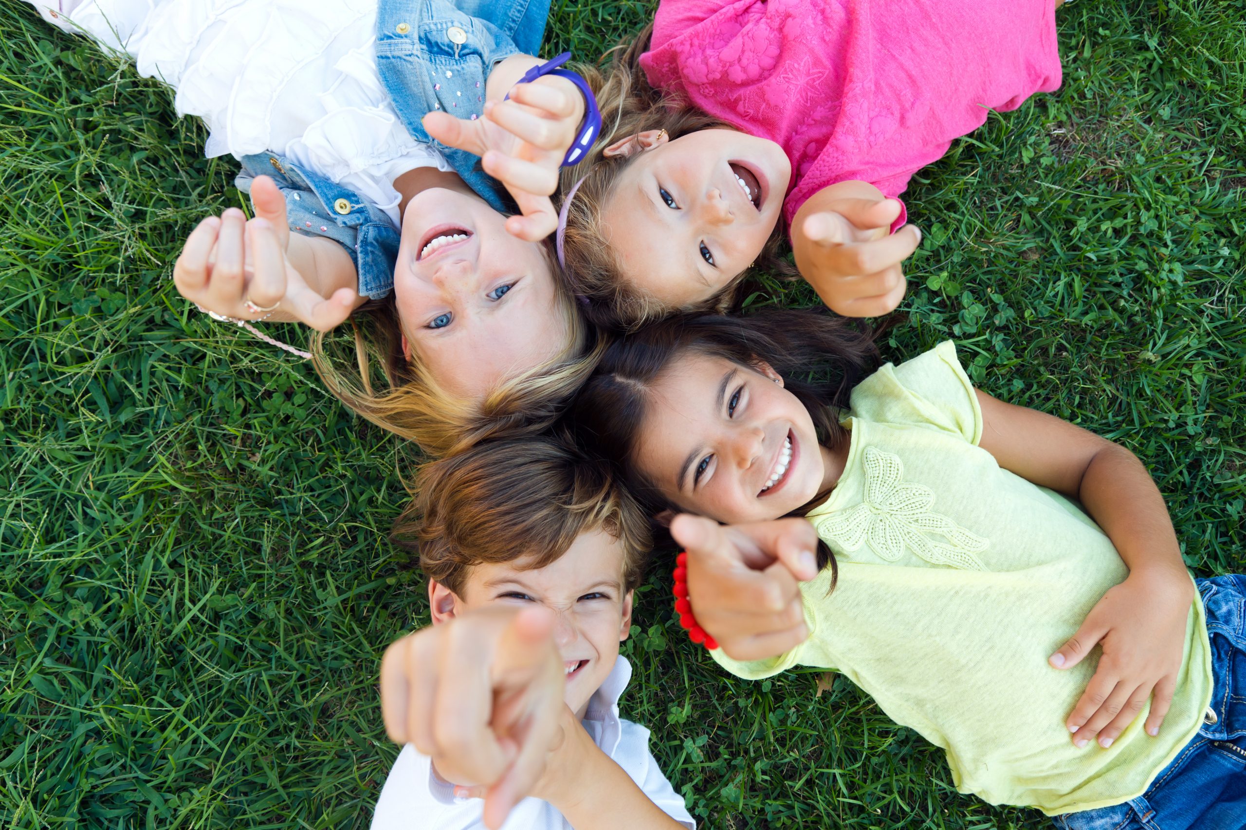 group of childrens having fun in the park scaled